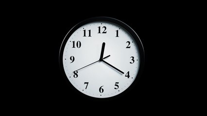 mixkit-slowly-approaching-a-clock-on-a-black-background-28897-hd-ready