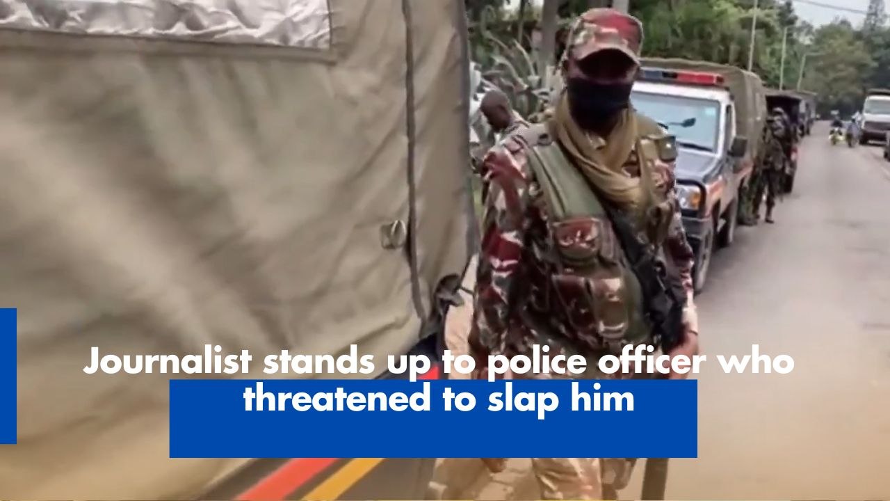 Journalist stands up to police officer who threatened to slap him