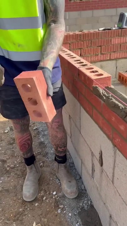 Laying bricks on a beautiful sunny day