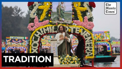 Catholic devotees honor St. Jude's relic with watery procession through Mexico's Xochimilco canals