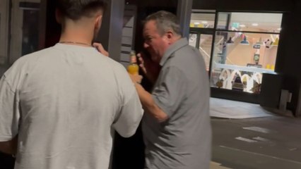 Bus stop mishap: Clumsy friend's head strikes in a stand