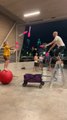 Duo Practice Juggling While Standing on Medicine Ball and Ladder