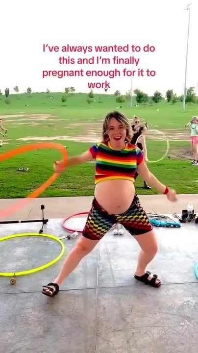 Pregnant Woman Spins Hula Hoop Around Belly