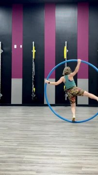 Woman Spins on Cyr Wheel