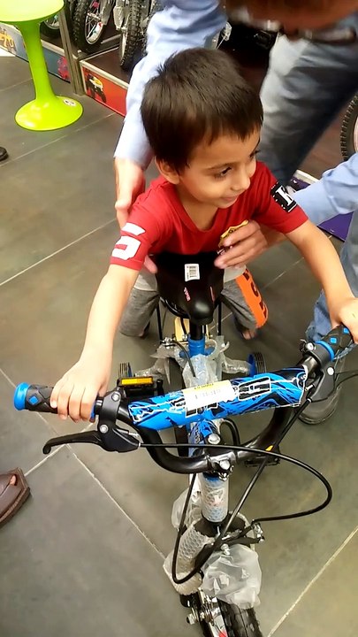 kid riding a cycle for the first time