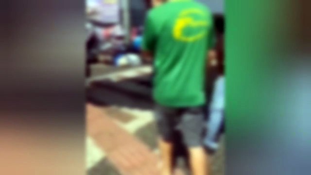 Homens saem na porrada em frente do Camelódromo em Campo Grande