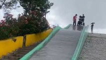 Girl's nostalgic slide ride ends with an unexpected collision with a pole