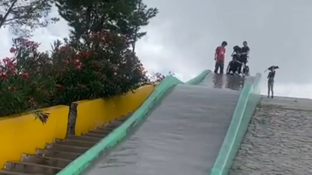 Girl's nostalgic slide ride ends with an unexpected collision with a pole
