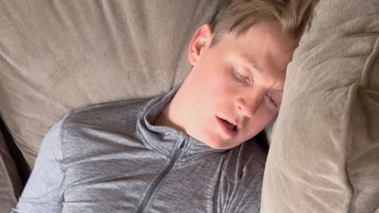 Girl tricks her boyfriend into talking to TV remote while he is asleep