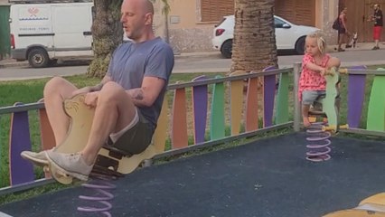 Man's failed attempt to ride a spring rocker becomes a hilarious moment during the family holiday.