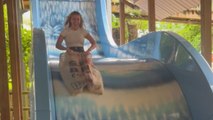 Hilarious clip of man getting cold feet before going down a SICK slide