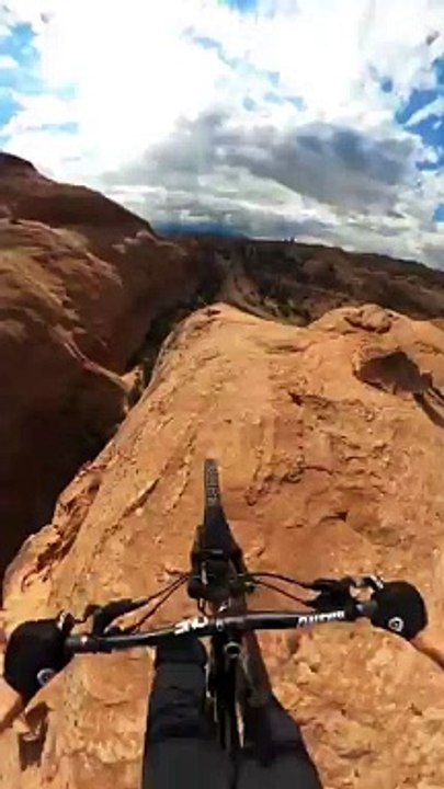 MTBer_rides_down_a_cliff_with_no_climbing_gear(360p)
