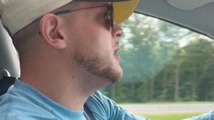 Girl halts boyfriend's singing on the road trip, leaving him confused
