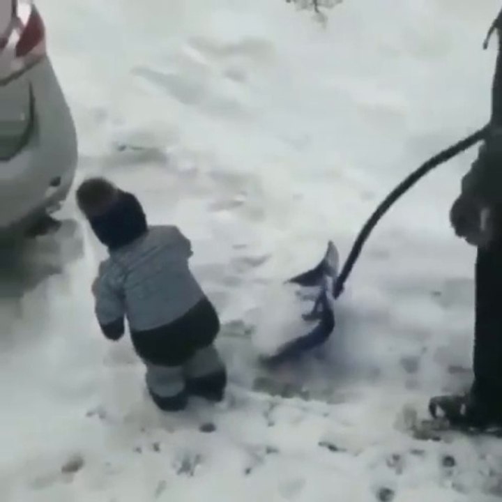 Baby working  with his father