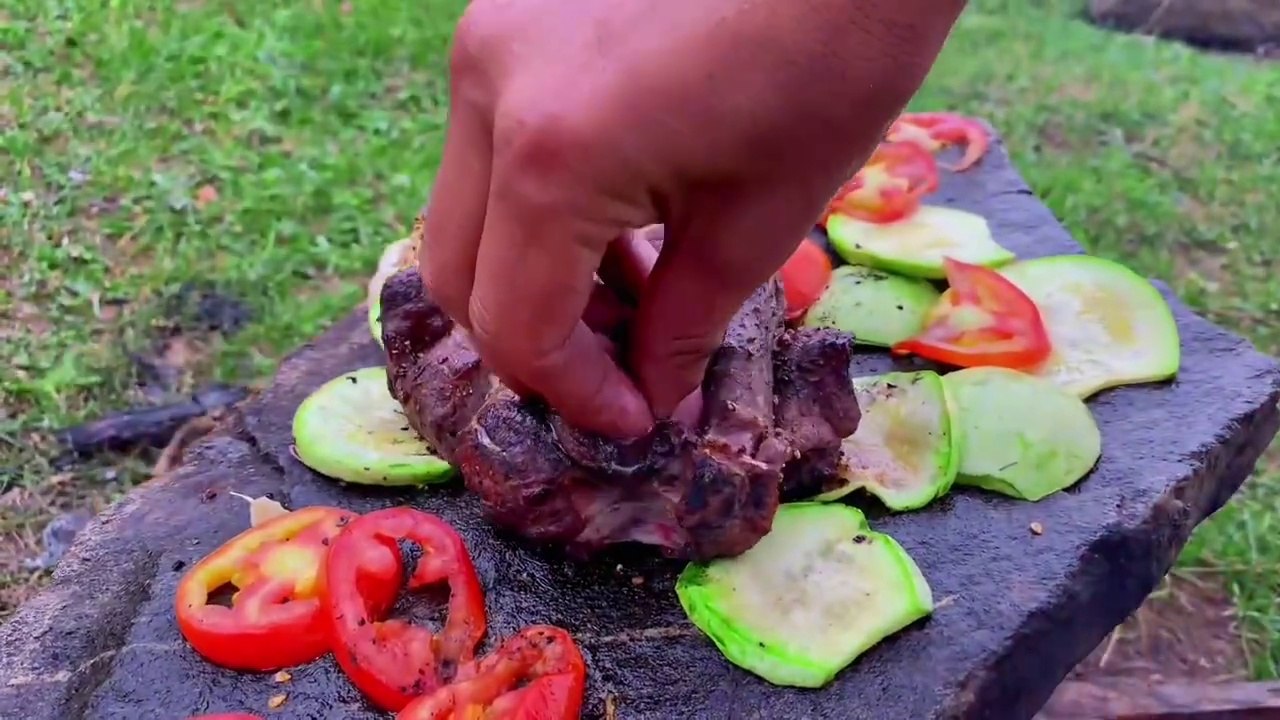 Outdoor Cooking Adventure- Grilling Meat on a Stone