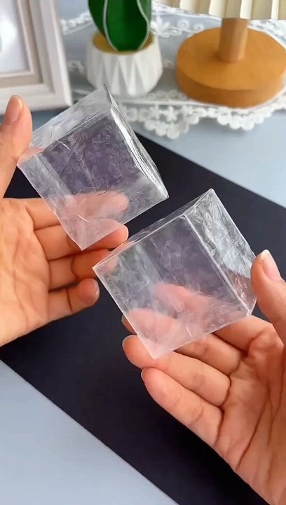 Create a fun and interactive squeezing square box using transparent tape.