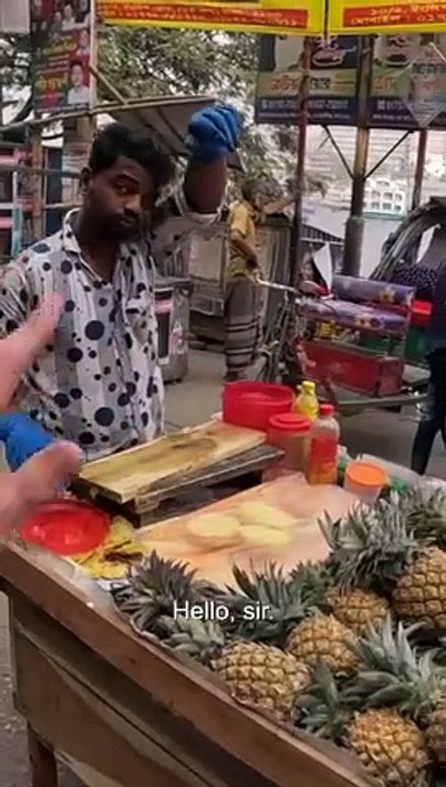 Would you eat this delicious street pineapple?    Across many countries in Asia, you' Il find stands selling fruit    But, this was the first time l'd seen a full service@artulaerie they cut it up for you... from scratch.  2  Initially I thought