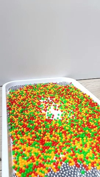 Tower of Plastic and Steel Beads Oddly Satisfying (Reverse)