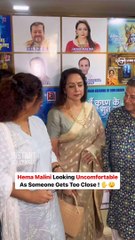 Hema Malini looking uncomfortable as someone gets too close.