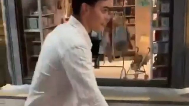 Drunken boy meets the fall after kicking a plant like a football