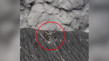 Video shows climbers on rim of erupting volcano run for their lives