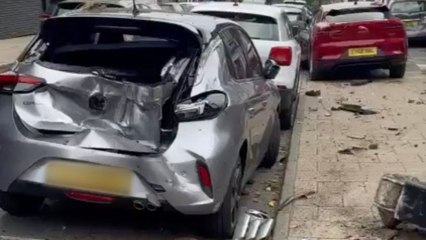Dramatic moment two cars narrowly miss cafe-goers as they veer onto pavement