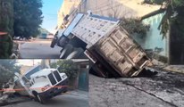 Camión que iba a tapar hoyos en la colonia Iztapalapa termina cayendo en socavón