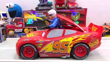 The little boy's favorite ambulance toy, Cars, and action figures slide across the table into the cardboard box