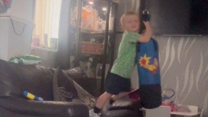 Confident boy's cling-and-swing action with punching bag ends in comical fail