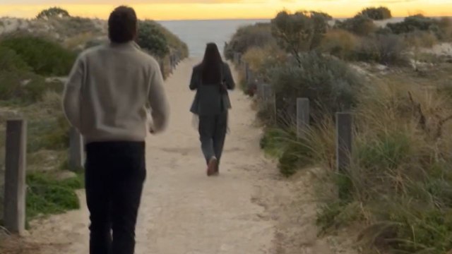 Boy surprises his girlfriend with a perfect proposal during a scenic beach walk