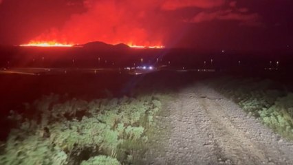 Erupting volcano in Iceland turns night sky red in breathtaking footage