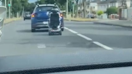 CRAZY mobility scooter fail moment shows man falling off his ride during car turn