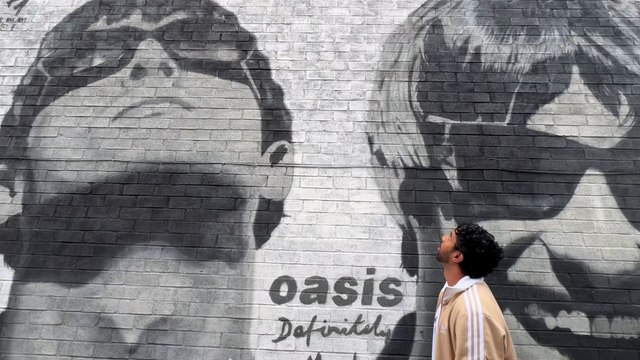 Oasis fans gather at music shop where Gallaghers bought records from as kids