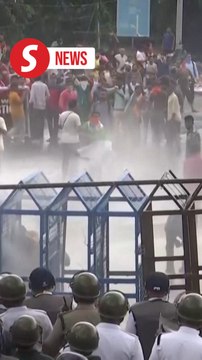 India police fire tear gas at crowds protesting doctor's rape and murder