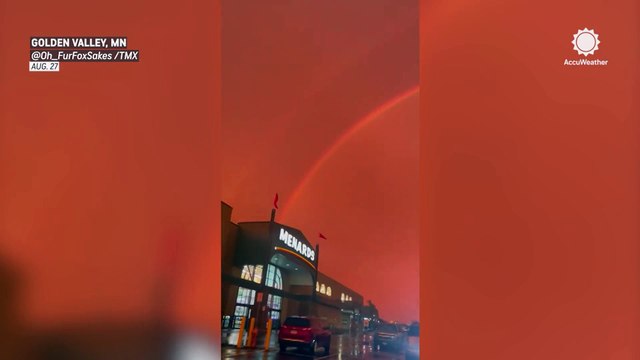 Spectacular red sky and rainbow light up Golden Valley sky