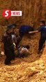 Cops buried in landslide while disposing of old bomb in stable condition