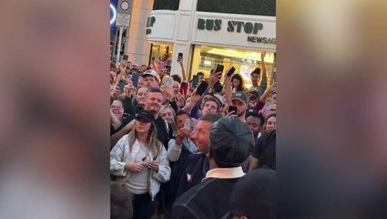 Coldplay, Burna Boy, and Little Simz busk on Dublin’s Grafton Street in surprise music video shoot