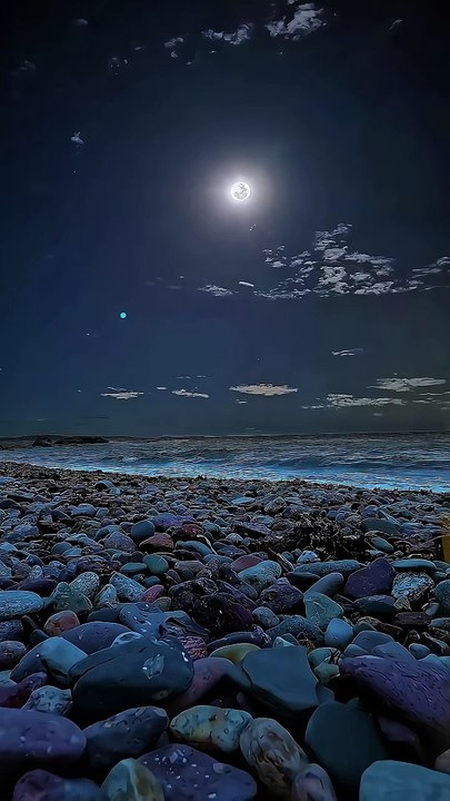 Colourful pebbles under a blue sky.