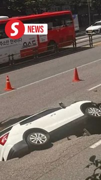 Two injured after sinkhole swallows car in Seoul