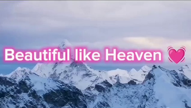 Tall mountains covered by ice and clouds