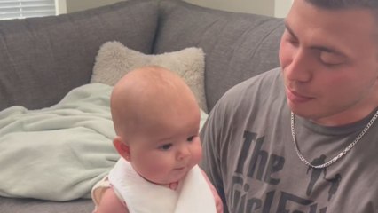 Baby girl's first encounter with apple sauce brings her smile and happiness