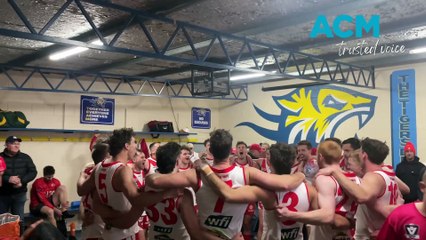 Ararat's senior footballers celebrate with the club song after its WFNL first qualifying final win
