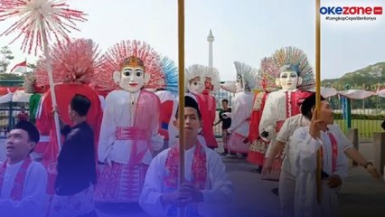 Prosesi Kirab Pengembalian Bendera di Jakarta, Atraksi Belasan Ondel-ondel Hibur Warga di Monas