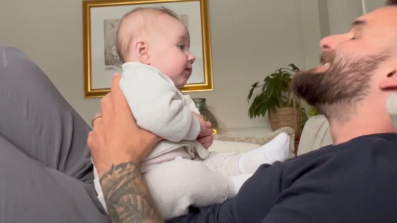 Dad's funny reenactment of monkey sounds gives baby daughter her 1st big belly laugh!