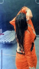 Beautiful dancing Indian girl in wet saree