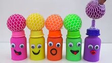 match rainbow colors squishy balls with kinetic sand milk bottles smiley face video for kids.