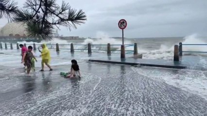 Tourist knocked off her feet by sudden tidal wave