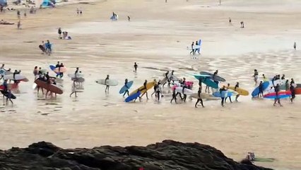 Surfers attend paddle out memorial for pioneer John Owen