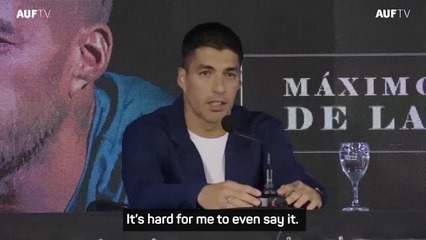 Teary-eyed Suarez announces international retirement