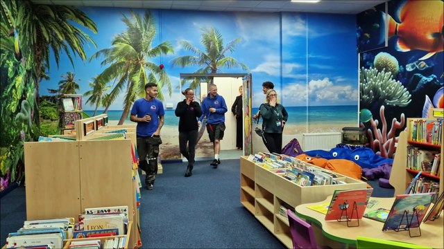 Thomas A Becket Infant School in Worthing reveals its new school library and author John Bond cuts the ribbon